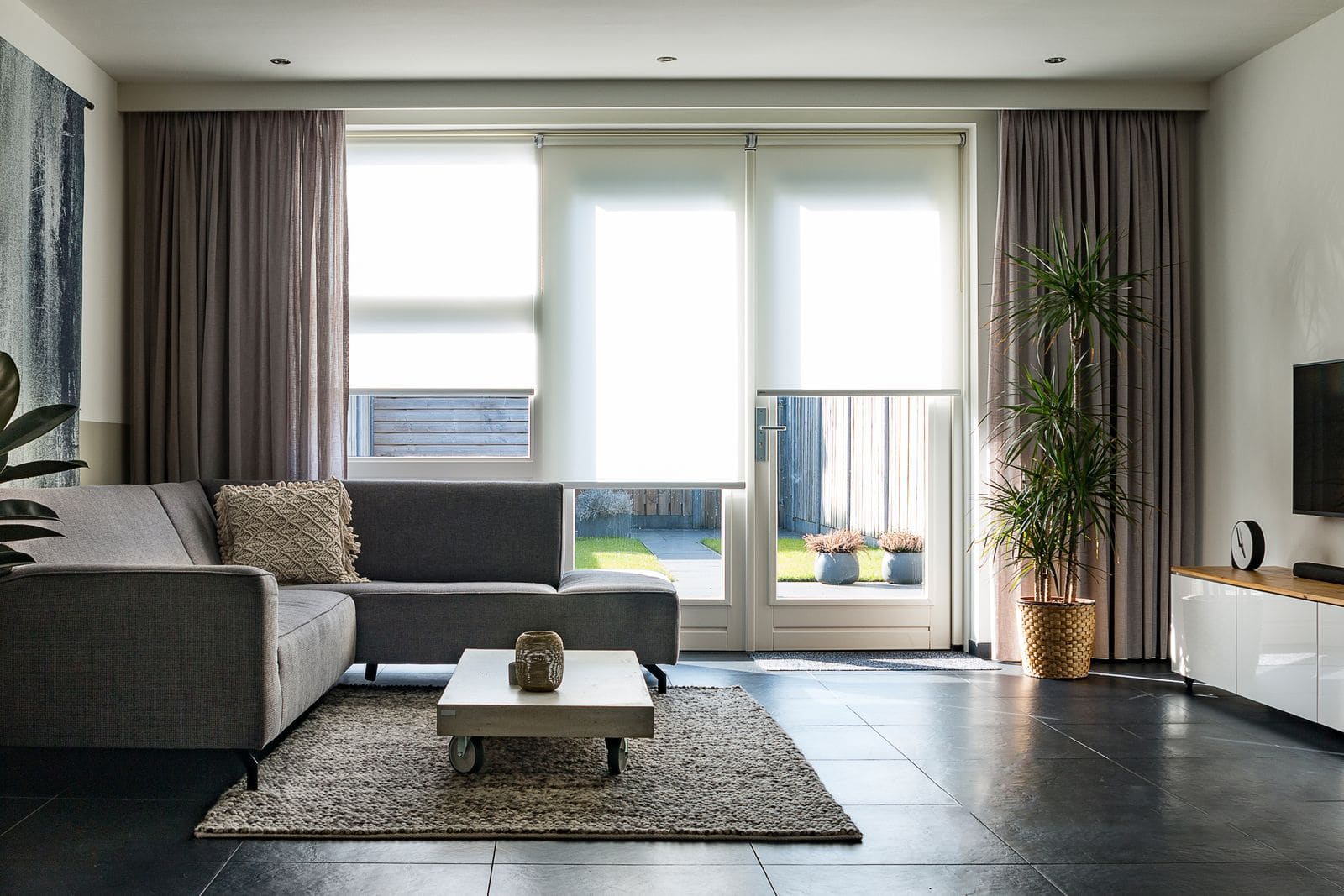 Custom roller shades in a bright living room